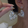 oly-d2b404a0e34d6ff48ed9b7cd100167ec Wholesale S925 Silver Needle Douyin Same Style Accessible Luxury Style Heart Full Diamond Crystal Earrings Fashionable Elegant High-End Earrings