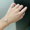 Wholesale Copper Italian brushed finish, natural pink mother-of-pearl three-flower bracelet, diamond-encrusted four-leaf clover clavicle chain.