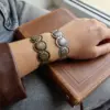 oly-d4ace29b66db3d28ba80501b6b4e0c6e Wholesale Retro Circle Bangle For Women In KC Golden Plated Alloy Featuring Electroplated Gold Finish
