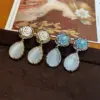 Wholesale Vintage Cat's Eye Stone Flower Waterdrop Earrings Versatile High-End S925 Earrings Geometric Pattern French Vintage Style Women's Jewelry