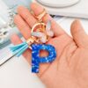 Wholesale blue crystal epoxy letter key chain pendant resin sequined butterfly key chain batch