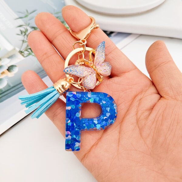 Wholesale blue crystal epoxy letter key chain pendant resin sequined butterfly key chain batch