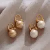 Wholesale Simple Style Round Alloy Inlay Pearl Women's Earrings