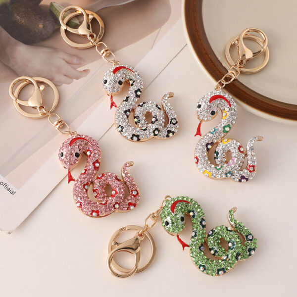 oly-d919e63512870417e977dcacc22b56f5 Wholesale Creative cartoon diamond twelve zodiac snake metal car keychain national tide this year pendant small gifts