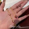 Wholesale Copper zircon four-leaf clover necklace, bracelet, and earrings set with red corundum, aquamarine, and white diamonds.