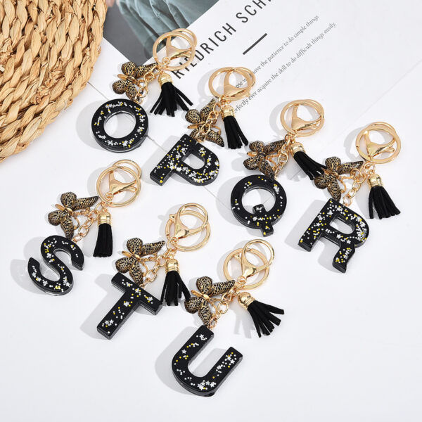 Wholesale resin black English letter car key chain pendant butterfly pendant tassel key chain decoration