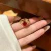 Wholesale Geometric Open Ring For Women In Brass With Golden Plated Water Plating And Claw Setting Featuring Artificial Gemstones
