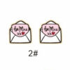 oly-e1d67b8f1098ec918ac1bfef76bf957a Wholesale Valentine's Day bear envelope love cupid arrow cake tape chocolate key wooden stud earrings