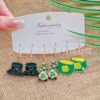 oly-e3eb7a6125448031bac0143e944ded8a Wholesale Patrick's Day carnival earrings suit personality green alloy oil drop clover hat earrings