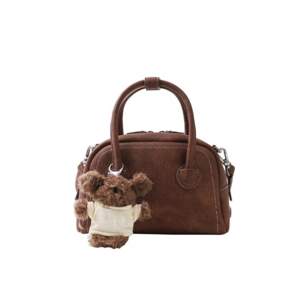oly-e47be8f739e6fafe2c954336a4ebfc0d Wholesale Korean niche brown bowling ball handbag for women, autumn/winter style, high-end retro crossbody bag.