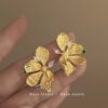 oly-e59eacf309adf6d4610b052b94eaca07 Wholesale Immersive Night Super Fairy French Retro Color Zircon Metal Flower Earrings Light Luxury High-end Niche Temperament