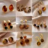 Wholesale 1 Pair Elegant Simple Style Geometric Plating Tiger Eye Drop Earrings Ear Studs