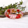 oly-e8c12cf04344bcf4eb703161f6c39917 Wholesale personality epoxy resin Crystal AB glue dried flower bracelet jewelry manufacturers wholesale and retail NG0021