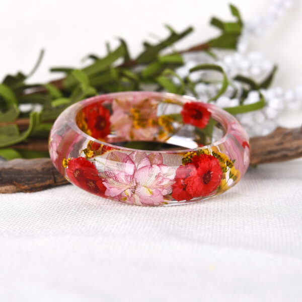 oly-e8c12cf04344bcf4eb703161f6c39917 Wholesale personality epoxy resin Crystal AB glue dried flower bracelet jewelry manufacturers wholesale and retail NG0021