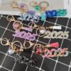 Wholesale Resin flash years digital creative accessories popular love hanging sequins mixed color keychain