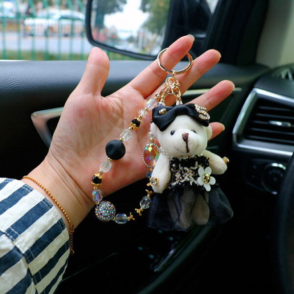 oly-eb219f3806290367e5dba38abad2be0a Wholesale Personalized style lace skirt bear car keychain exquisite crystal bracelet bag pendant creative key chain