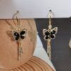 oly-eca1afb42a2b1e6a96ac71d55610bab4 Wholesale Black butterfly earrings high-grade light luxury slightly elegant all-match earrings earrings niche design