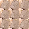 Wholesale 205 Double Layer Stacked Necklace Butterfly Star Four-Leaf Flower Simple 18K Gold Plated