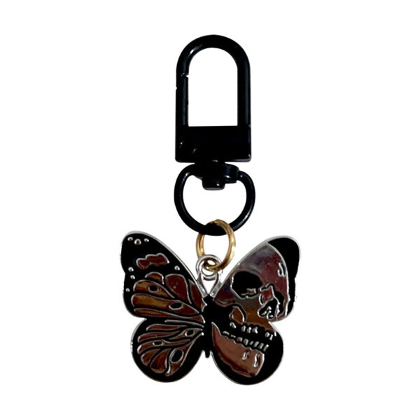 oly-ef8d6affa7df51eaed85af045a294681 Wholesale game series trendy skull butterfly keychain Halloween vintage pendant cold style all-match OLY Exclusive