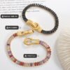 oly-f01974e5ddb6c8332b44f88953defb1d Wholesale light luxury seven kinds of color zircon double-sided iron buckle design suction bracelet titanium steel gold-plated four-corner buckle jewelry