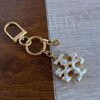 oly-f026b52fde886b12a356bdbca02dac5b Wholesale fashion · simple commuter niche design enamel glaze hand painted English letters metal keychain