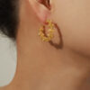 oly-f2bf20cd586db7660ee7a8abc6475bcd Wholesale selling niche personalized jewelry round bead woven stitching design copper material C-type earrings