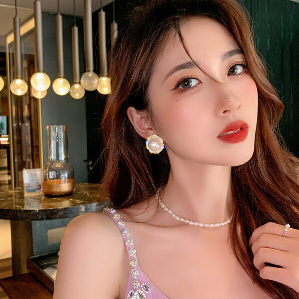 Wholesale Copper and silver needle Chanel-style stud earrings with diamonds, pearls, and zircon stones