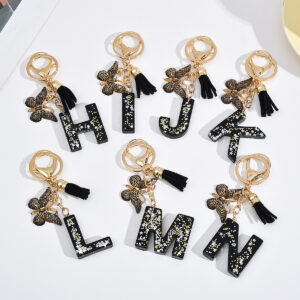 Wholesale resin black English letter car key chain pendant butterfly pendant tassel key chain decoration