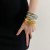 oly-f7c196db450737deb9fbfd5f1993c8ad Wholesale Light Luxury Multi-layer Gold and Silver Stacked Stretch Bracelet Women's Niche High-end Retro Bracelet Autumn and Winter Hand