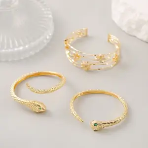 Wholesale Snake Pattern Bangle In Copper With 14K Real Gold Electroplated Finish Featuring Zircon Inlay In Gold