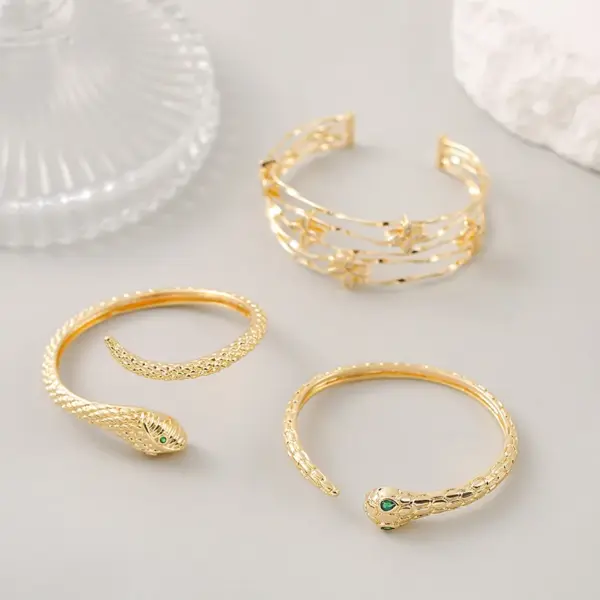 Wholesale Snake Pattern Bangle In Copper With 14K Real Gold Electroplated Finish Featuring Zircon Inlay In Gold