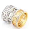 Wholesale Unisex Geometric Rings In Titanium Steel With PVD Coated Gold Plating And Rhinestone Inlay Featuring Cutting Craft