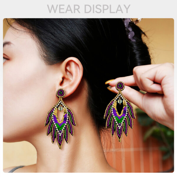 oly-f9ccc31c94a634244c6575b39815a077 Wholesale Ethnic Style Carnival Festival Earrings Autumn and Winter High-end Fashion Handmade Rice Beads Feather Exaggerated Earrings for Women
