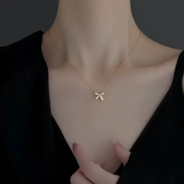 Wholesale Women’s Bow Tie Pendant Necklace With Inlay Artificial Rhinestones, 18K Real Gold Plated Copper, Water Plating On Cable Chain