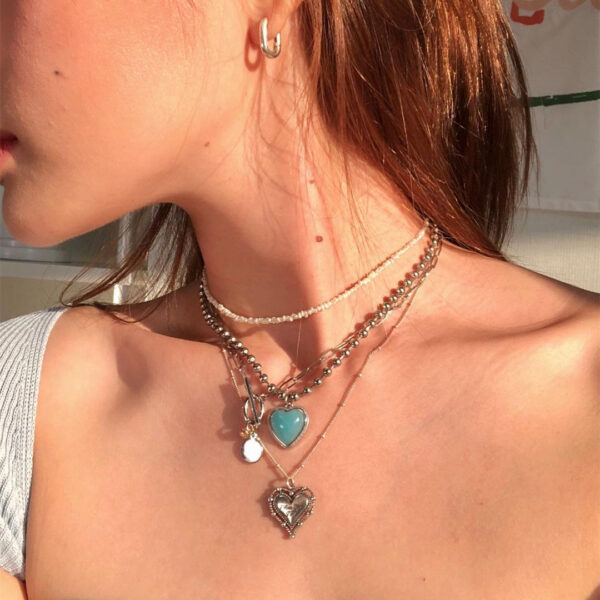 oly-f9df74a612bf5f7374cd782e21d2a668 Wholesale Korean blogger with Angel jelly love hollow diamond heart necklace titanium steel fashionable clavicle chain for women