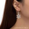 Wholesale Autumn and Winter Hollow Snowflake Alloy Drape Earrings Simple Flower Earrings Christmas Girl Heart Earrings Fresh Earrings