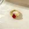 Wholesale Geometric Open Ring For Women In Brass With Golden Plated Water Plating And Claw Setting Featuring Artificial Gemstones