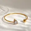 Wholesale Asymmetrical Round Bangle For Women In 304 Stainless Steel With 18K Gold Plated And PVD Coated Finish, Artificial Pearl Inlay