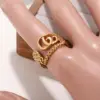Wholesale Three-dimensional Letter Open Ring For Women In Copper With Golden Plated UV Plating And 0.03µm Thickness