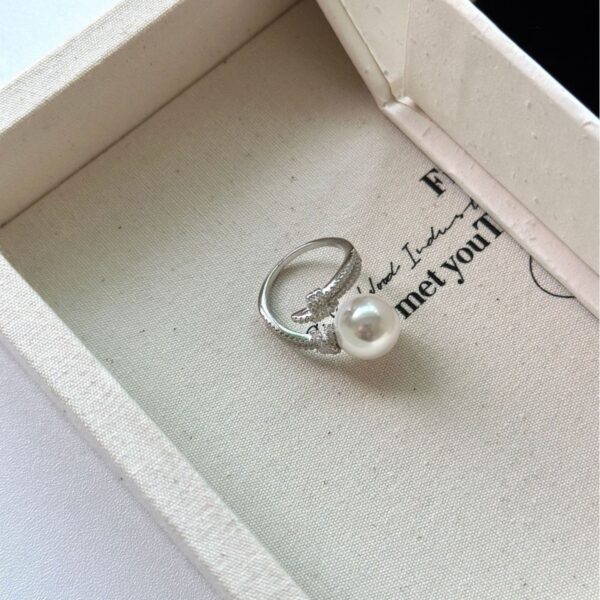 oly-ff033ea559af8466dbd8b99b41e42447 Wholesale S925 Silver Heavy Industry Full Diamond Winding Australian White Single Pearl Ring Women's Noble High-end Light Luxury Open Ring