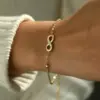 oly-ff50d5b60a66c0dddd12d5faa7fd2bc0 Wholesale 18K Gold Plated 304 Stainless Steel Vacuum Electroplating (In Furnace) Rhinestone Infinity/8-Shaped Classic 03 Bead Chain Necklace For Women Independence Day