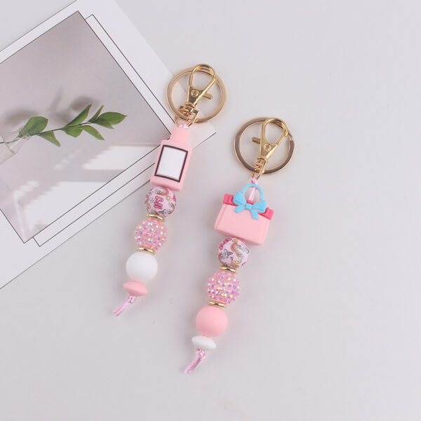 oly-020dfeae2ef54b0ea98d23732d229614 Wholesale Fashion Silicone Perfume Bottle Keychain Resale Gift Accessory