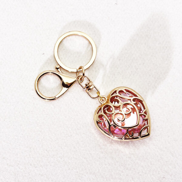 oly-0816400f91d7f98ff25a56688958eb13 Wholesale Fashion Metal Heart Keychain Pendant, Red Hollow Design, European Style Bag and Key Accessory OLY Exclusive