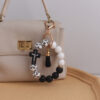 oly-0b17098501d663e4166878bf000b408a Wholesale Silicone Cross Print Bead Bracelet Keychain with PU Tassel Fashion Accessory for Resale
