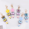oly-0d1a2c6d1a2f73fab41445e05ea749f3 Wholesale Korean Style Silicone Butterfly Flower Keychain DIY Decorative Accessory Gift