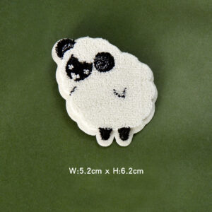 Black and white toothbrush embroidered with sheep