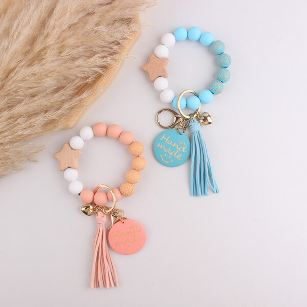 oly-0f3d02de894bc4f368dbd5785b6b4d40 Wholesale Silicone Keychain Retro Face Wooden Plaque Tassel Wristlet Party Gift for Junior
