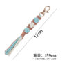 oly-10739da028a465458b5515d24e8a3785 Wholesale Trendy Handmade Cotton Rope Keychain Dog Paw Pattern Turmeric Color Festival Gift Car Key Accessory