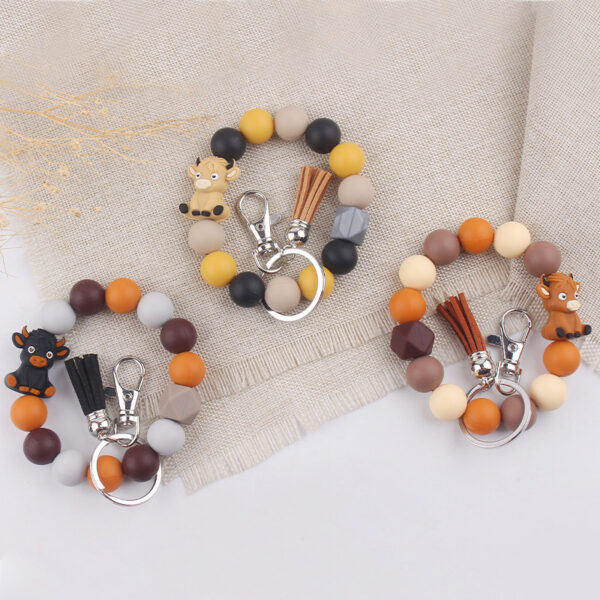 oly-1654fa8ff4384629237c2e144889847d Wholesale Silicone Cartoon Cow 3D Keychain Khaki Festival Gift Fashion Accessory