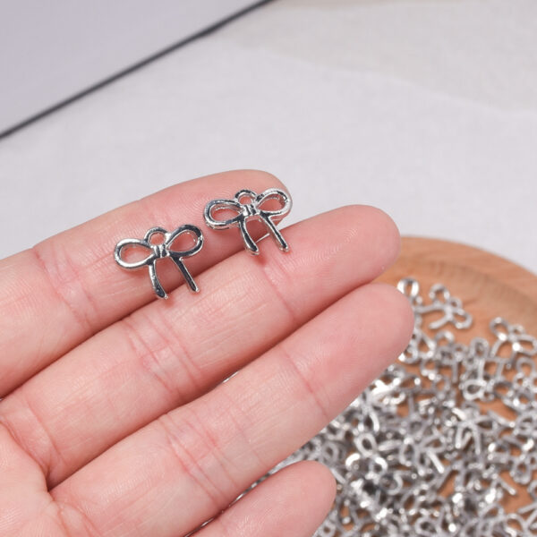 oly-167f57f404aa9622fd355028a3d8f53d Wholesale Trendy Small Bow Tie Pendant Zinc Alloy Fashion Accessory for DIY Jewelry Making Gift Resale